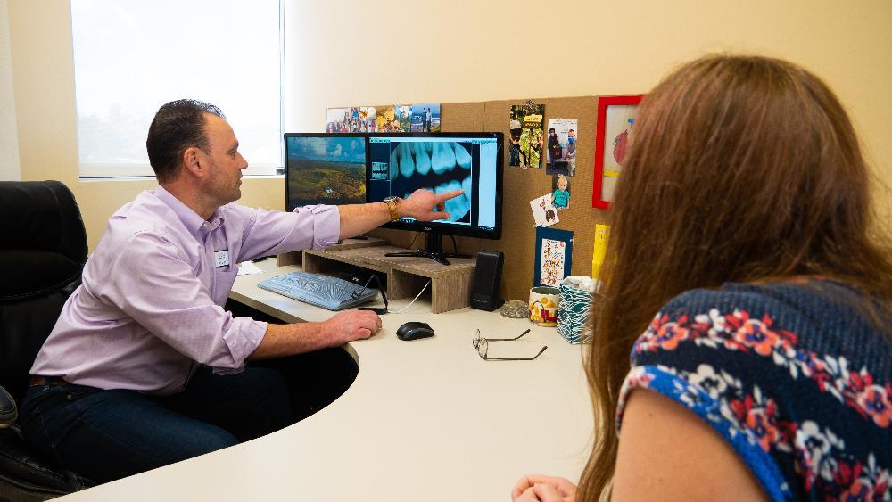 dr sierk with parent at pediatric dental office