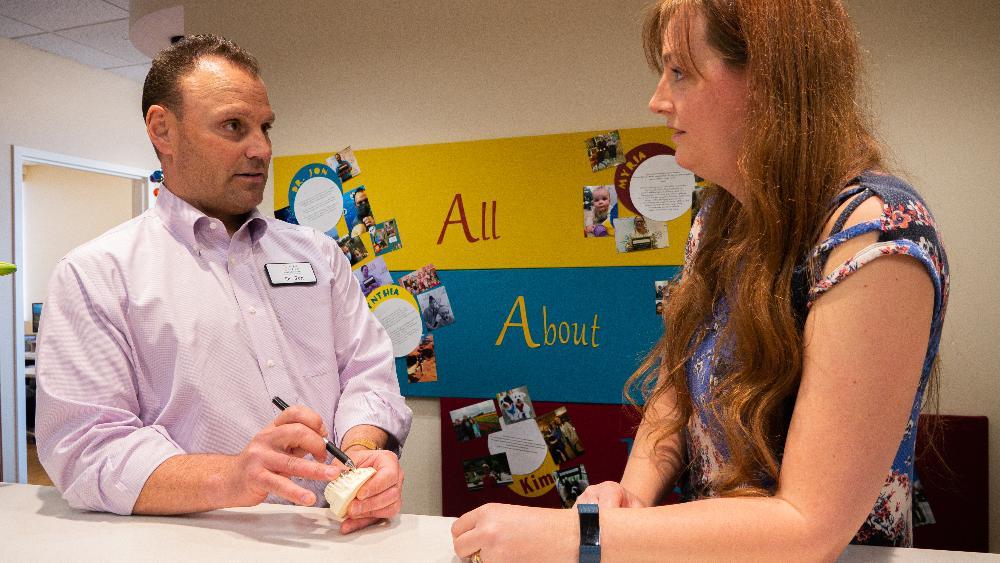 dr sierk with parent | Castle Pines emergency pediatric dentist